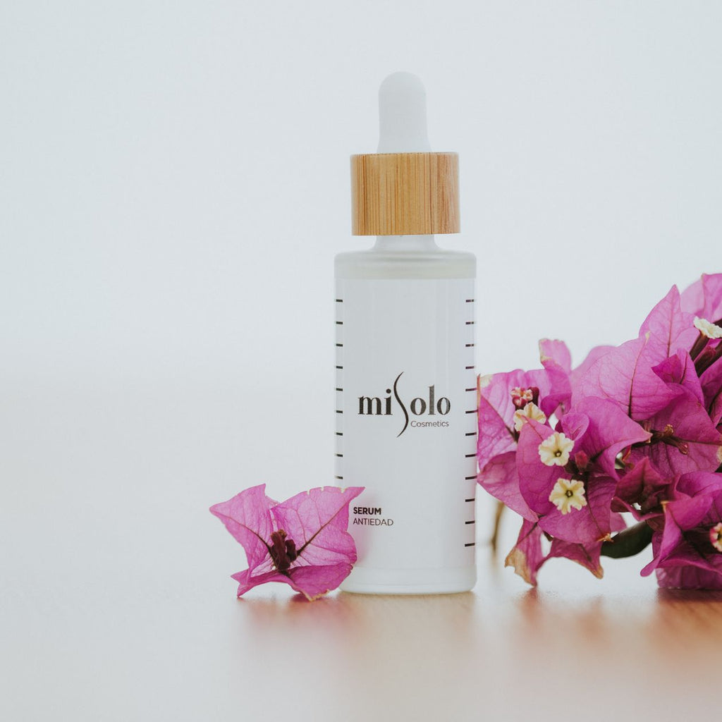 LumaLift skincare bottle near flowers