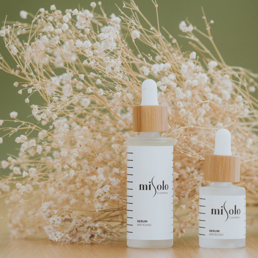 LumaLift skincare bottles styled with dried flowers